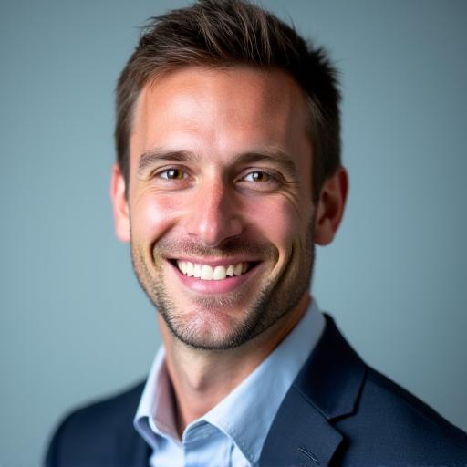 Professional headshot of Ben Carter, a man with a friendly expression and short hair.